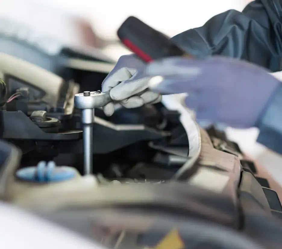 Vehicle engine undergoing maintenance