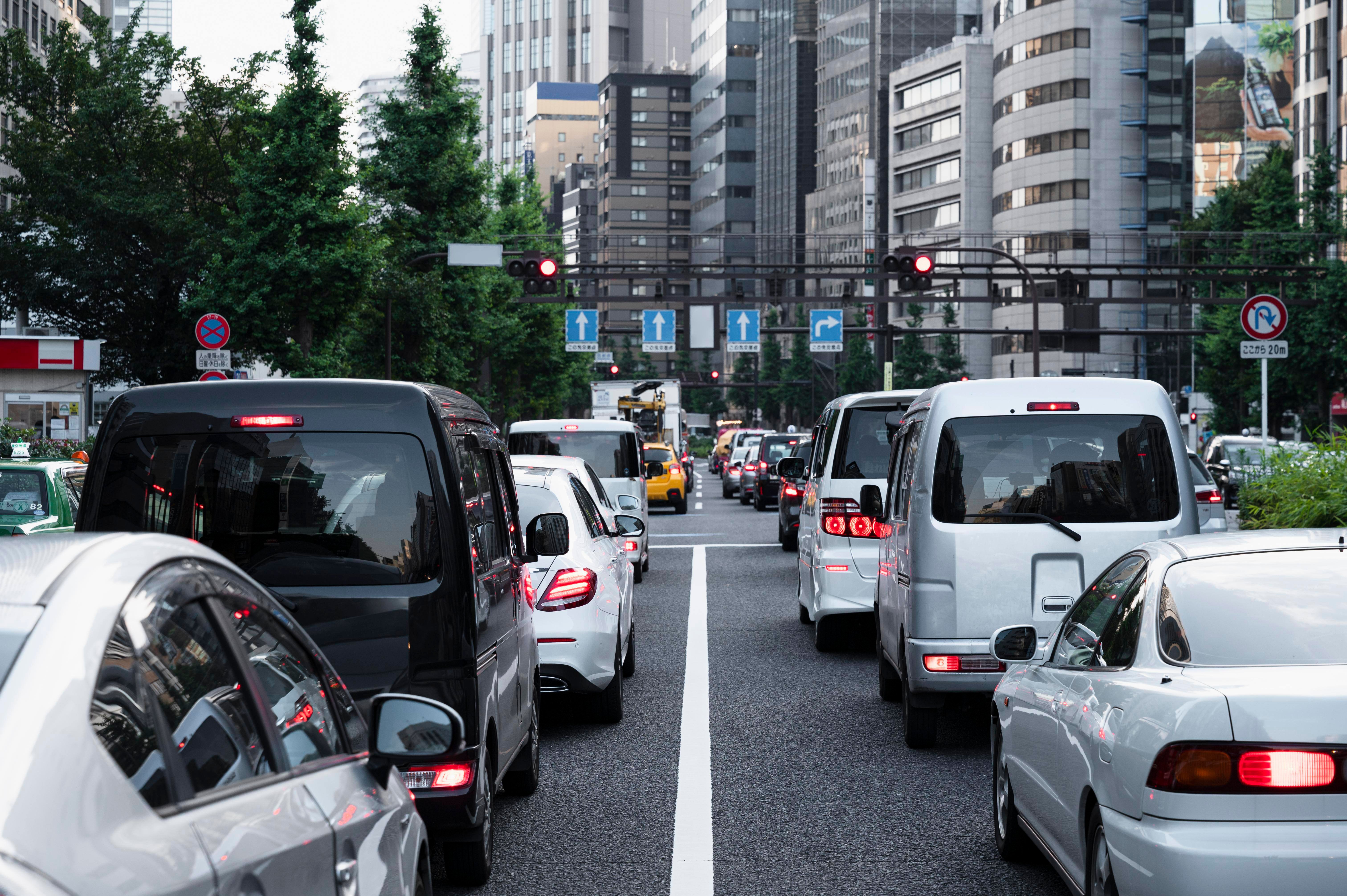 people-driving-cars-city-street