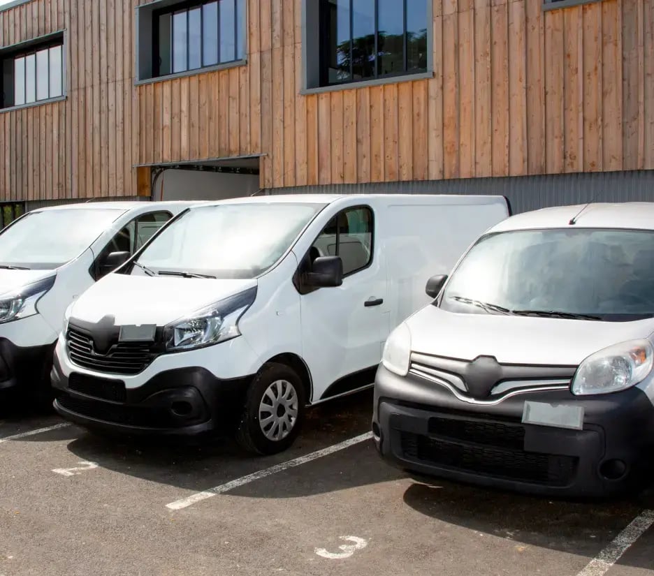 A row of vans in an office car park